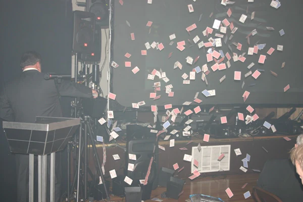 Confetti filling the air above event guests