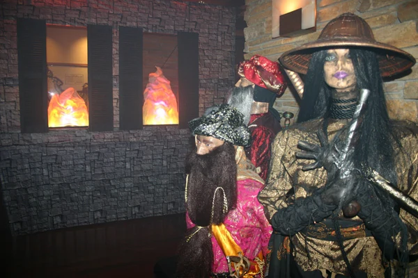 A performer inside a cinematic haunted attraction