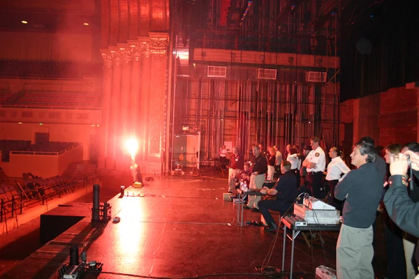 A live pyrotechnic effect illuminating a dark venue